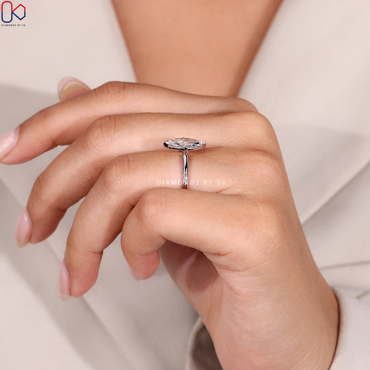 Claw prong setting ring with white gold finish.
