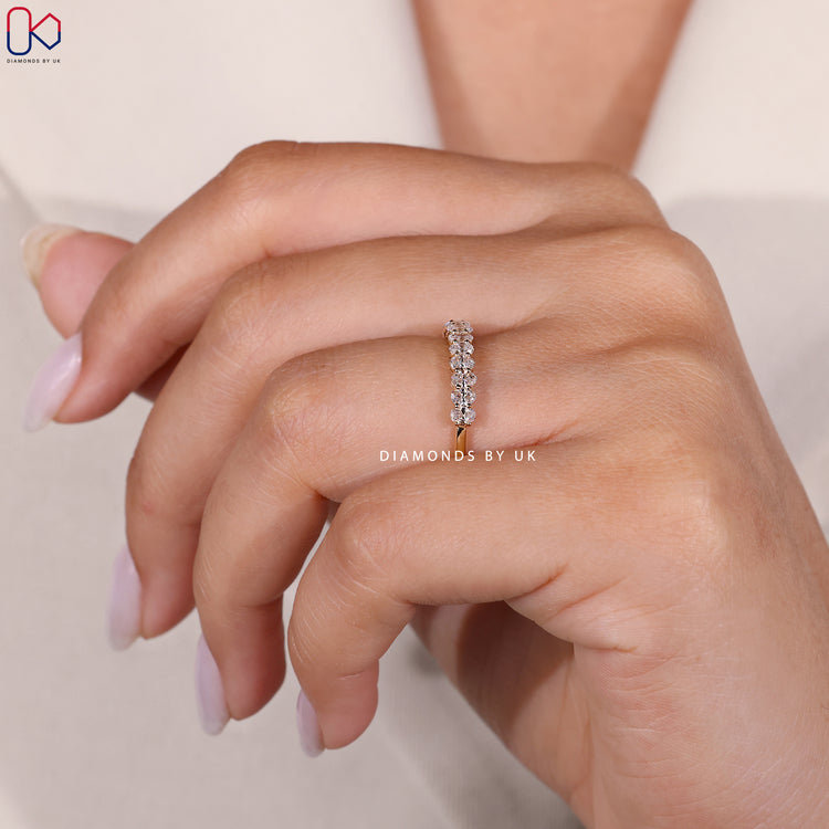 Buy yellow gold half eternity diamond band online.
