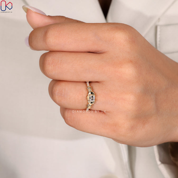 Asscher diamond ring with round side stones
