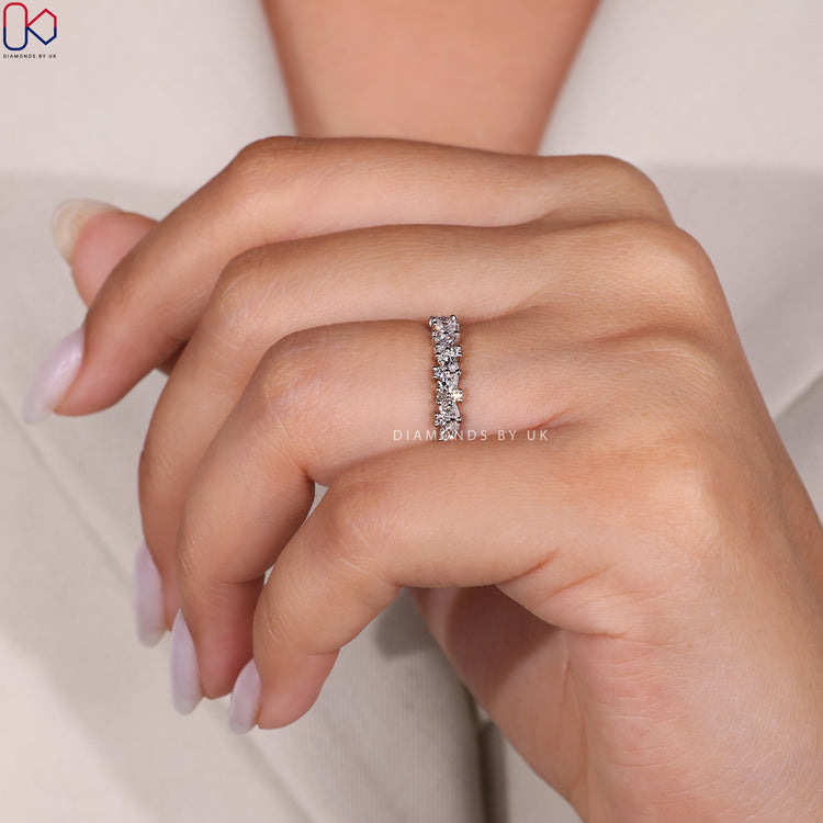 Diamondsbyuk band with half eternity pear and round stones.
