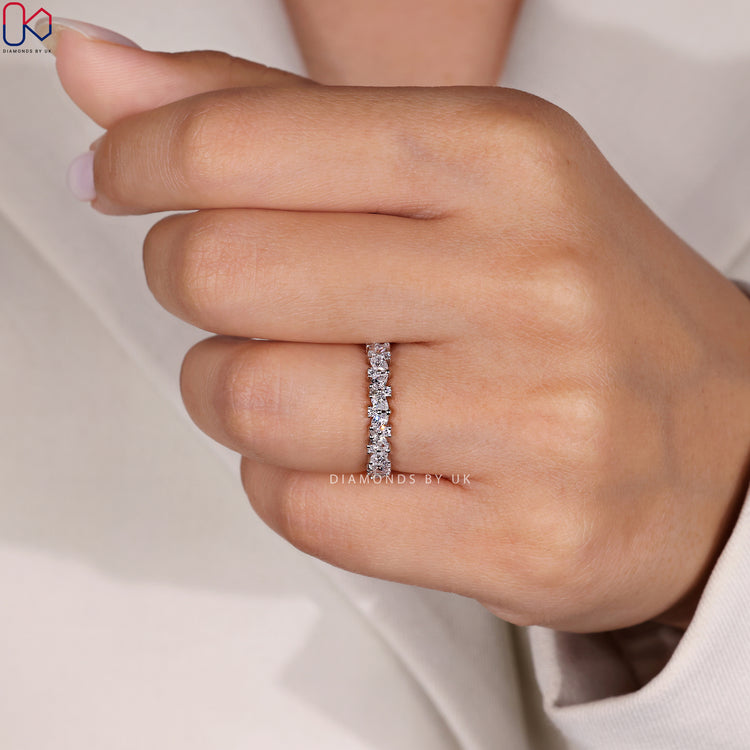 Shared prong wedding band in white gold finish.
