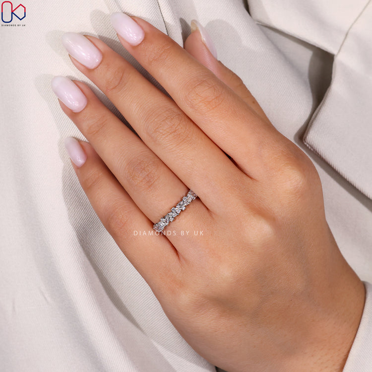 Custom wedding band with half eternity design.
