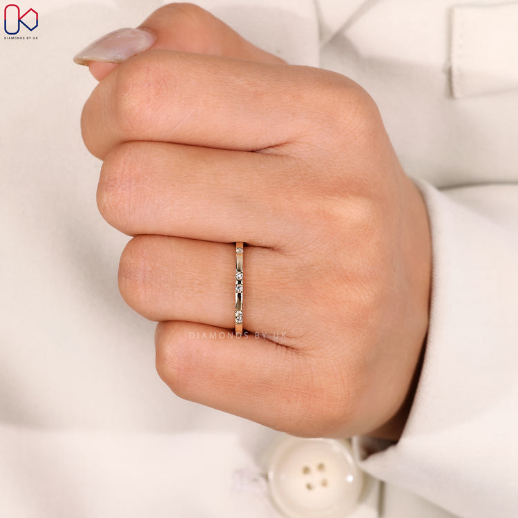 Yellow gold gypsy set wedding band with minimalist design.
