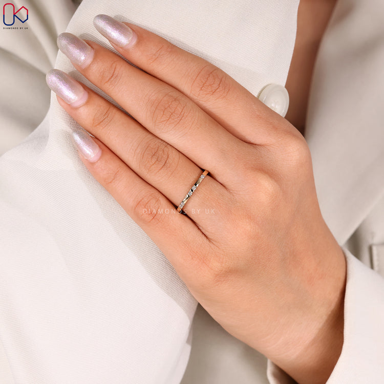 Simple distance pave yellow gold diamond band.
