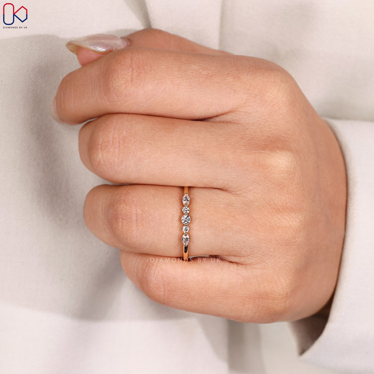 Handmade band with oval and round diamonds.
