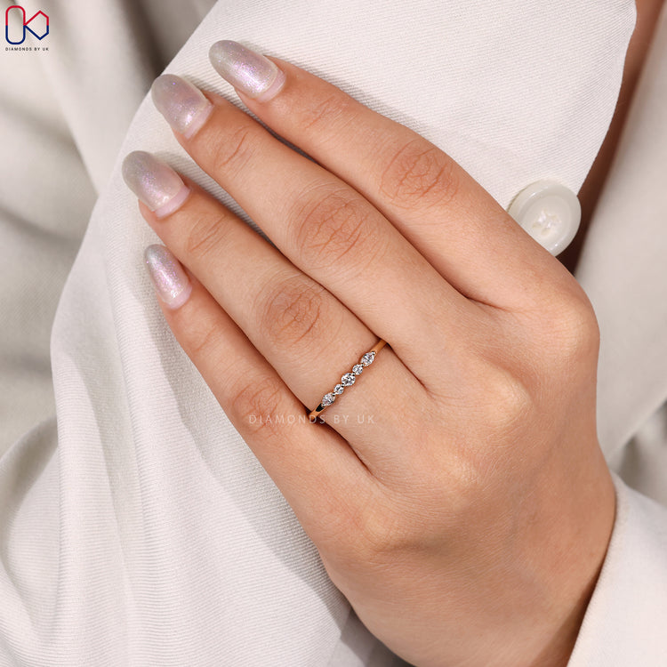 Yellow gold diamond band with mixed cut stones.
