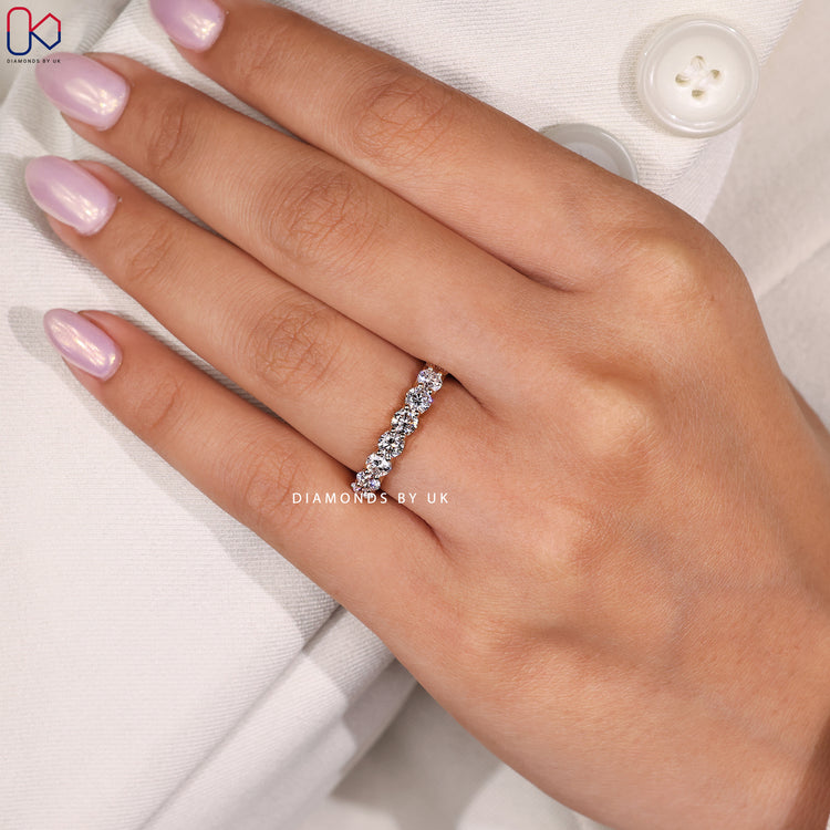 Yellow gold round cut diamond band.
