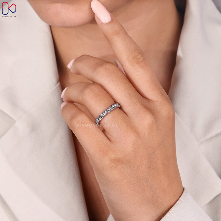 Round diamond wedding band with handmade jewellery detail.
