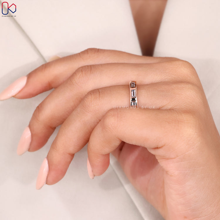 Baguette cut half eternity band with bezel setting.
