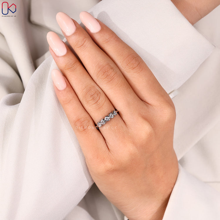 Handmade band with heart-shaped diamonds.
