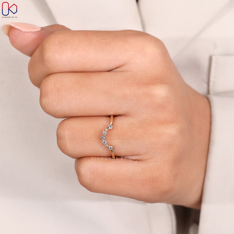 Handmade jewellery featuring a round diamond wedding band.
