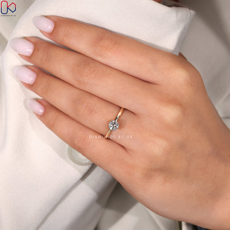 Two-tone gold solitaire diamond ring
