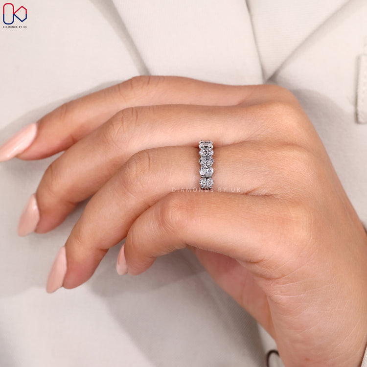 8 stone wedding band in shared prong style.
