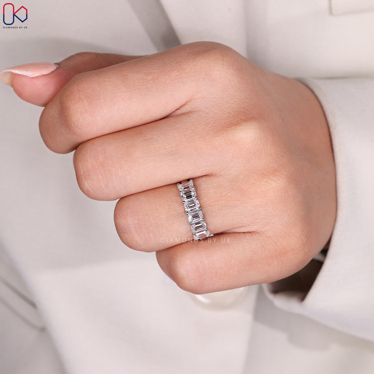 Custom diamond band with emerald cut stones.
