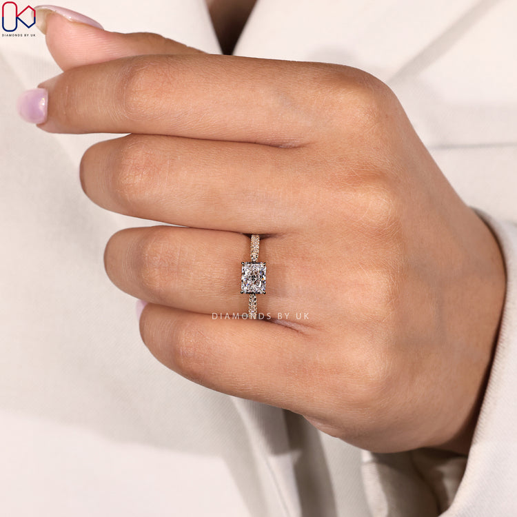 Yellow gold diamond ring with radiant cut stone.
