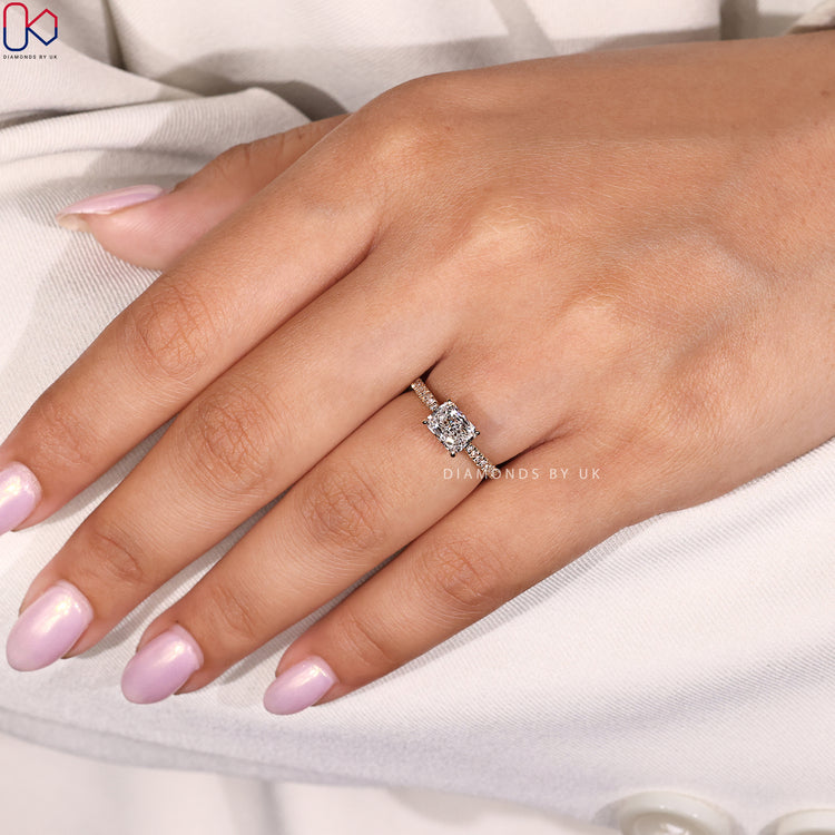 Hidden halo diamond ring with radiant cut centre stone.
