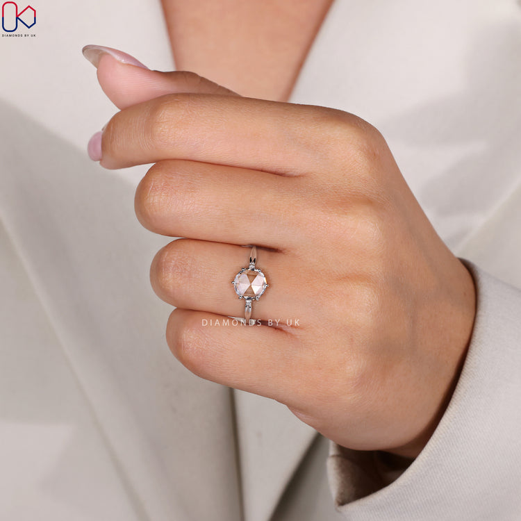 Three stone diamond engagement ring with rose cut centre.
