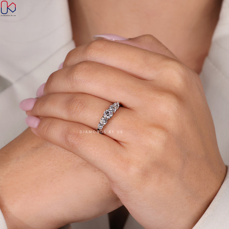 Handmade band featuring round diamonds in white gold.
