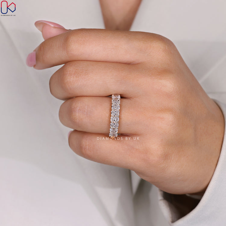 Handmade jewellery showcasing a half eternity radiant cut diamond band.
