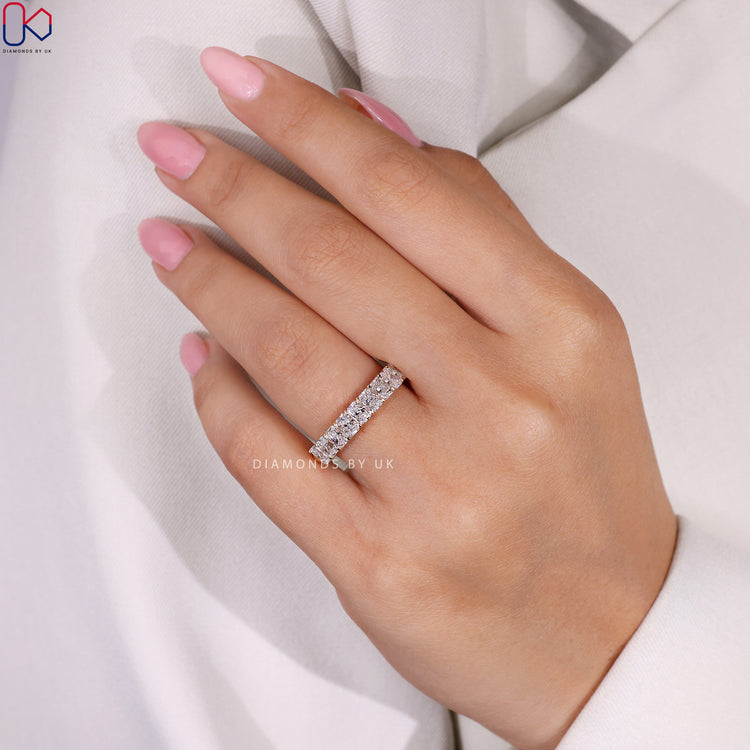 Handmade band in yellow gold featuring radiant cut lab grown diamonds.
