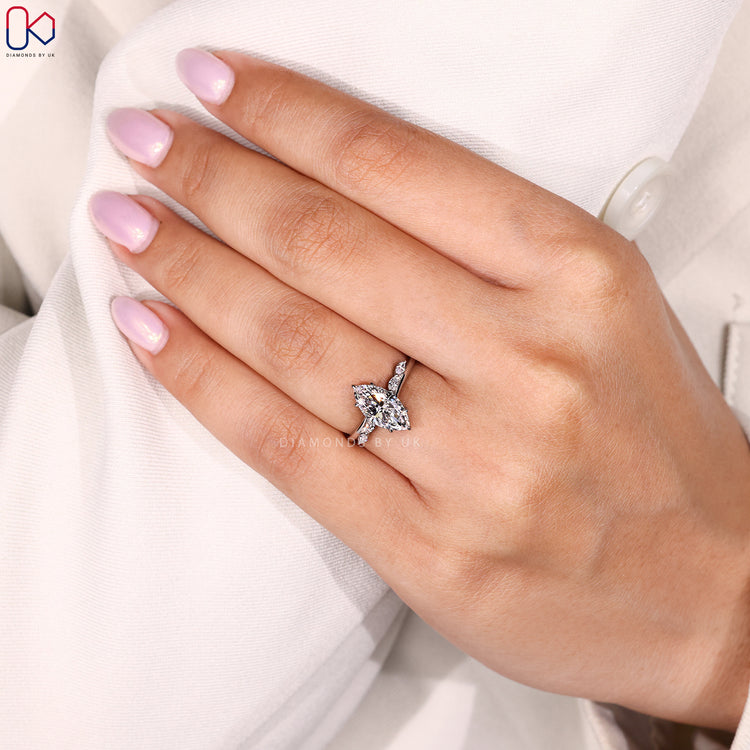 Lab grown marquise cut diamond engagement ring.
