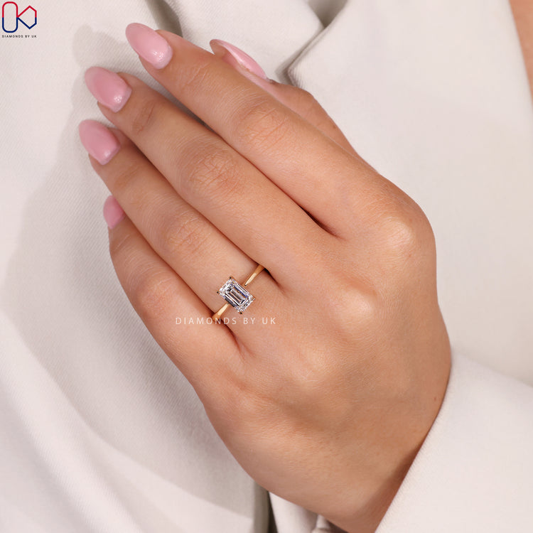 Handmade ring with a prong set emerald diamond.
