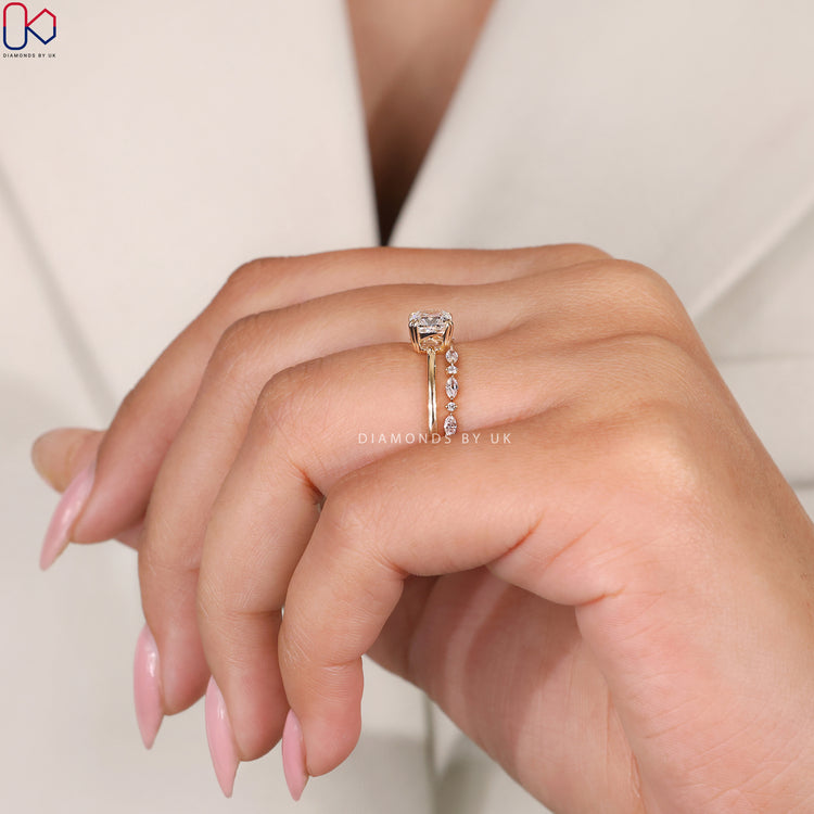 Double claw prong ring holding a cushion cut diamond securely.
