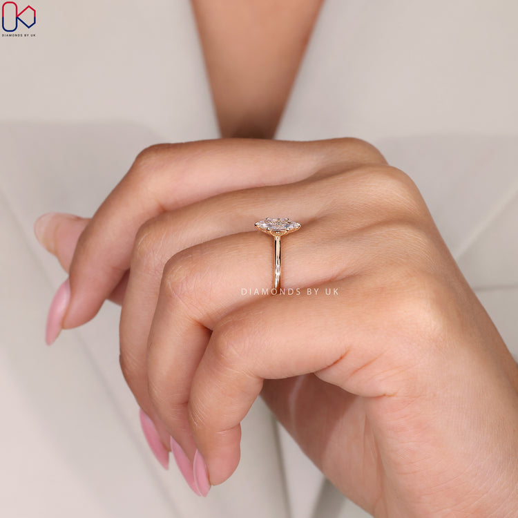 Classic diamond solitaire ring with a yellow gold band.

