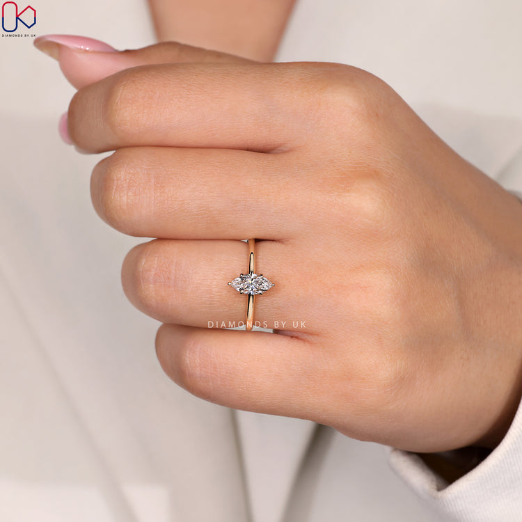 6 claw prong setting for a marquise diamond ring in gold.
