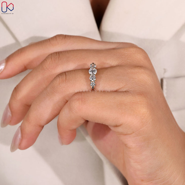 Shared prong wedding band with 5 stones.
