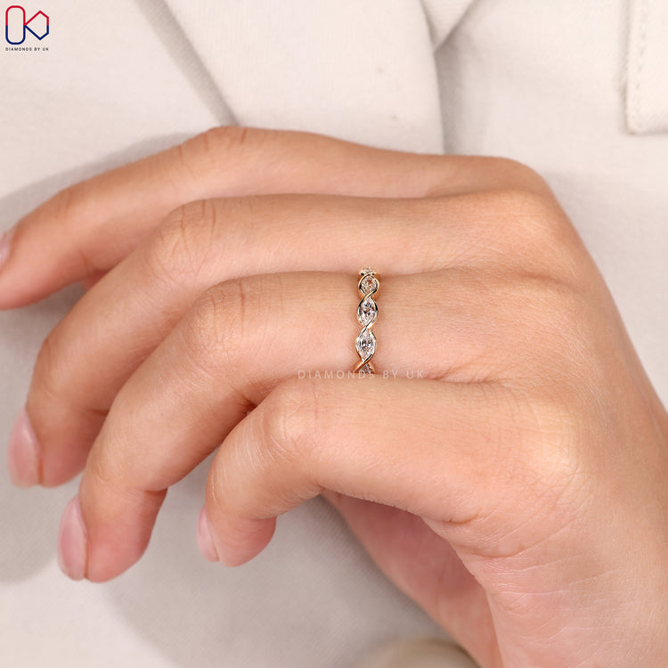 Marquise wedding band with bezel setting.
