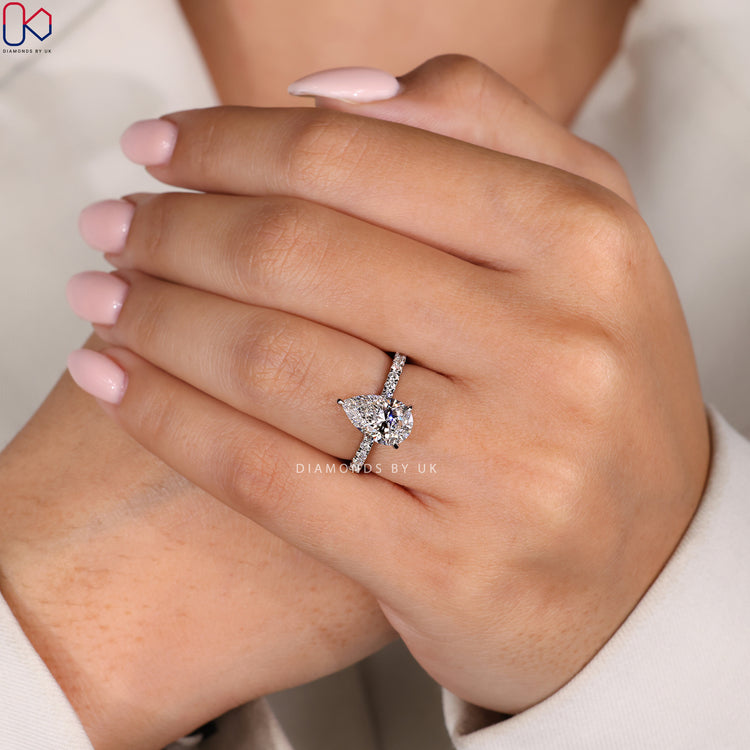 Customize ring with a hidden halo and pear cut diamond.
