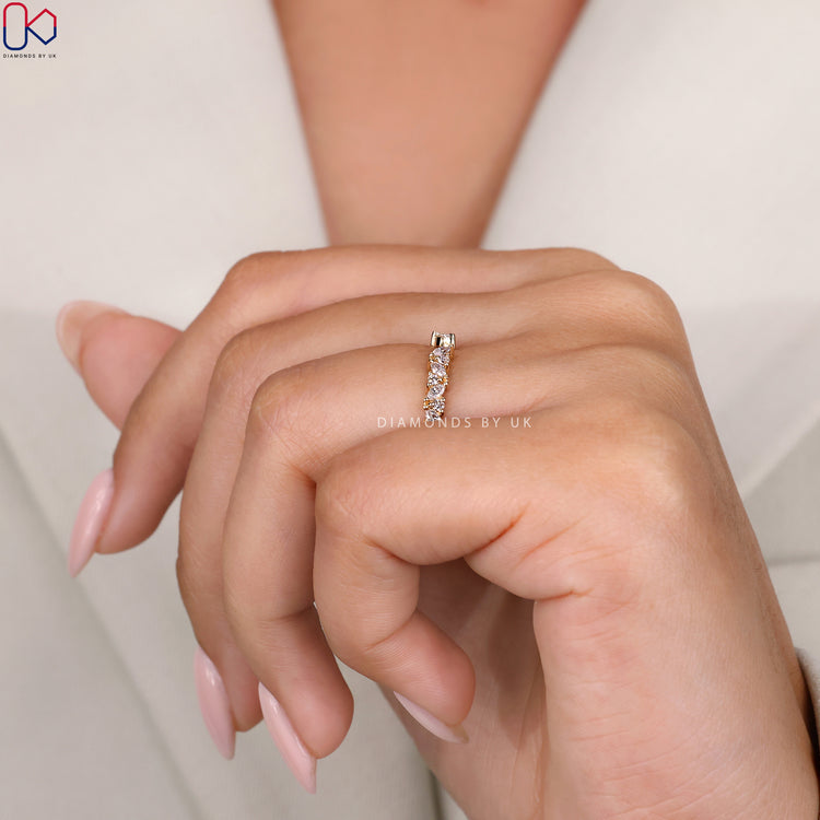 Lab Grown Diamond band in yellow gold with open design.
