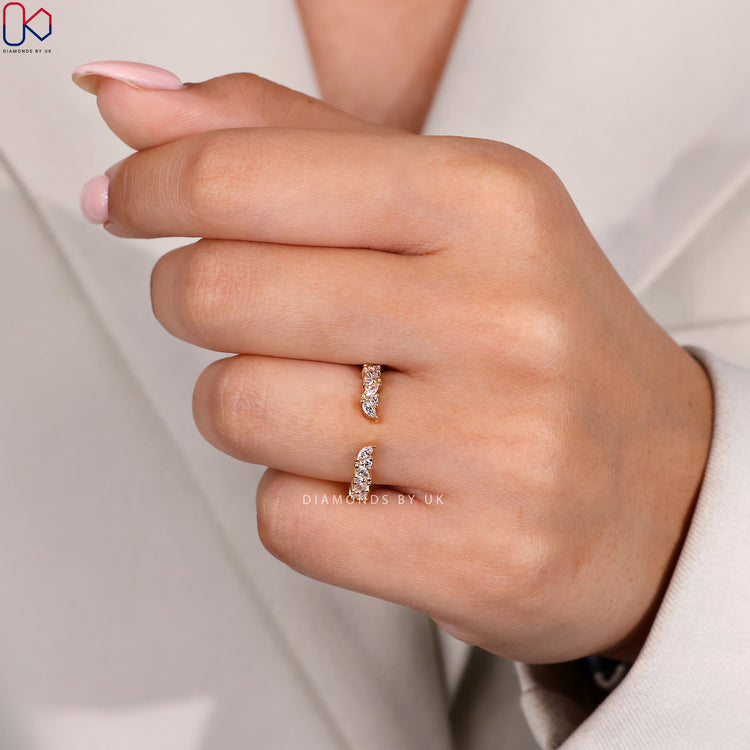 Custom wedding band with open gap and prong setting.
