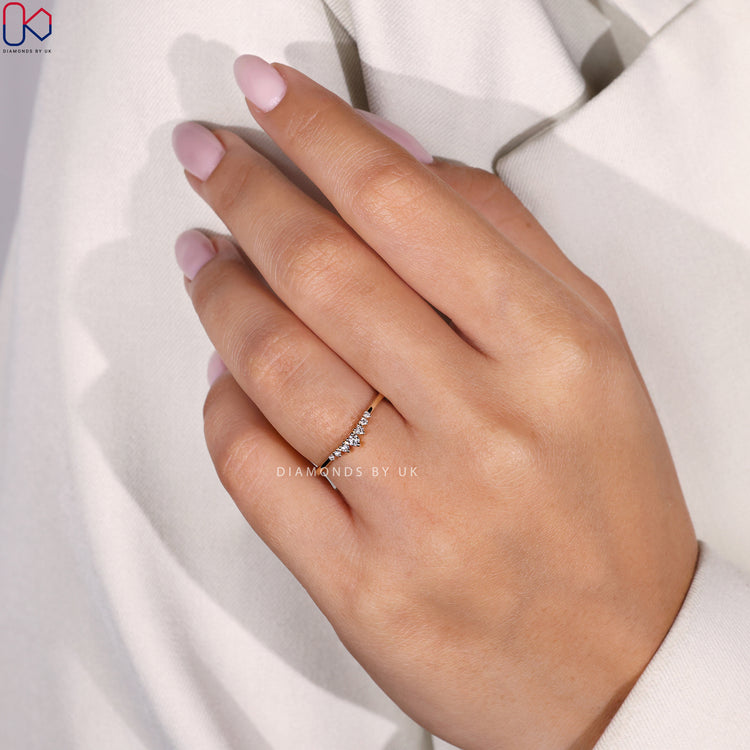 Handmade jewellery with a yellow gold 7 stone wedding band.
