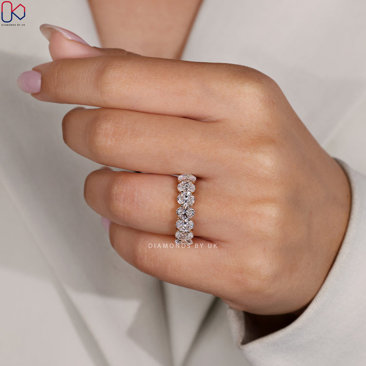 Lab Grown Diamond band designed with oval cut stones and prong setting.
