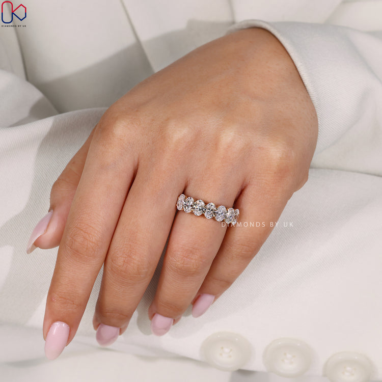 Diamondsbyuk wedding band featuring oval cut half eternity style.
