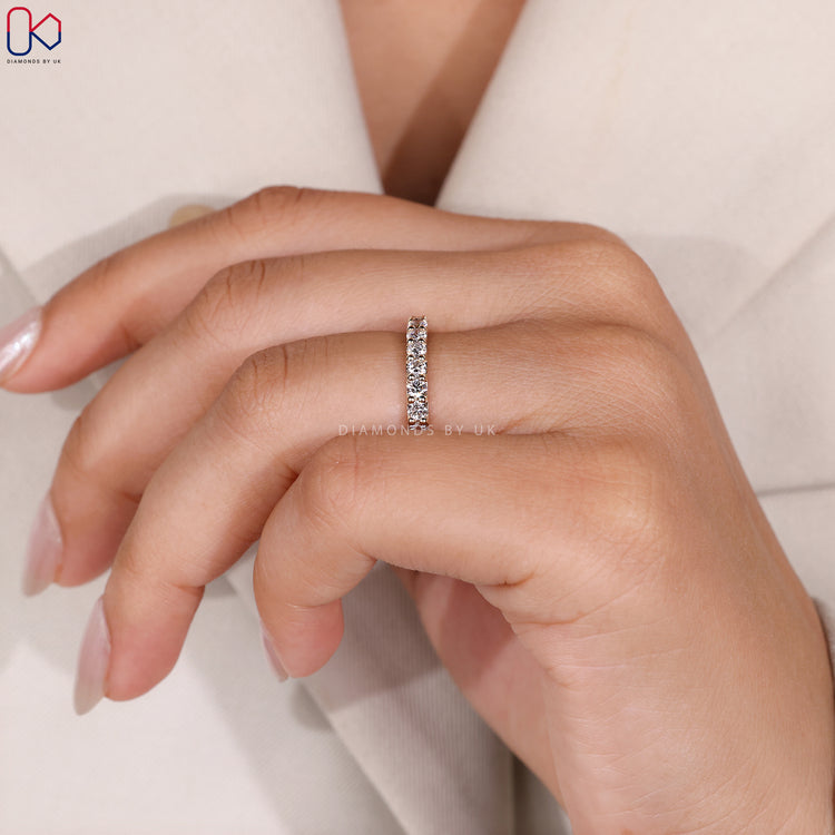 Shared prong wedding band with round diamonds.
