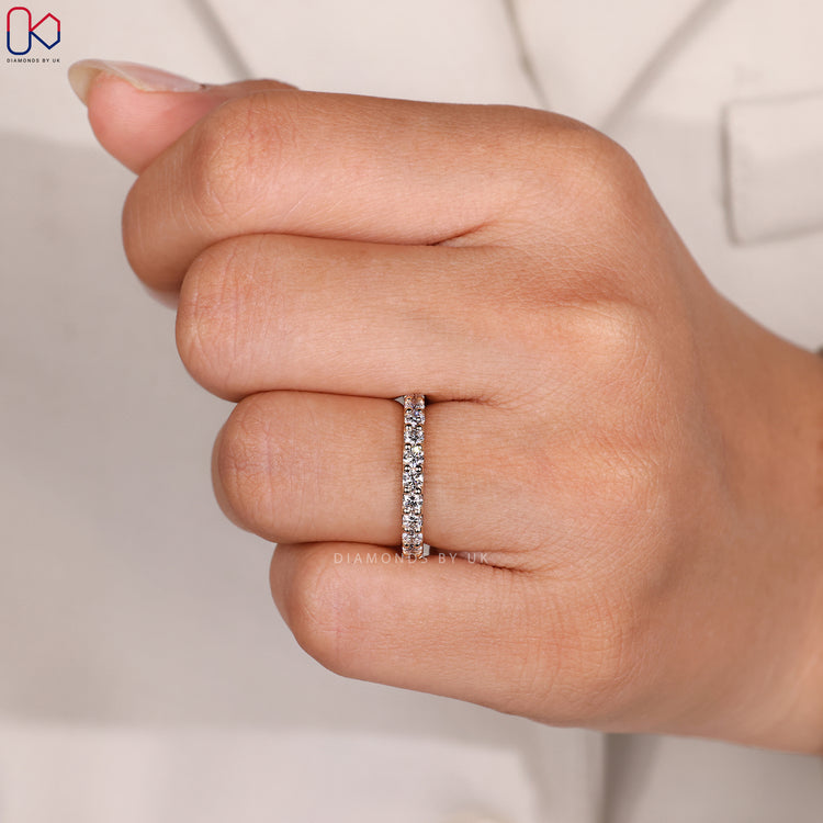 Custom diamond band with round stones.
