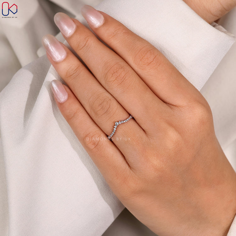 Custom diamond band with curved design.
