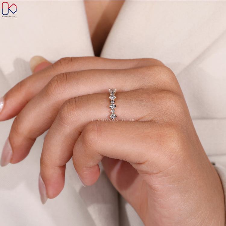 Shared prong wedding band with round diamonds.
