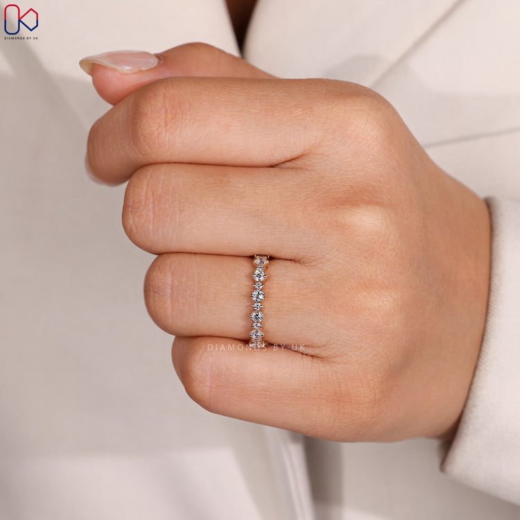 Custom diamond band with round stones.
