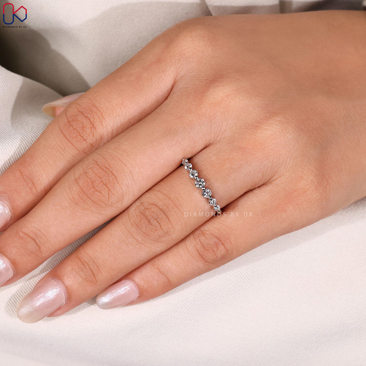 Floating bubble prong diamond band showcasing elegant brilliance.
