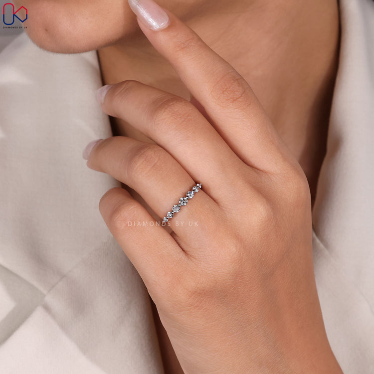 Buy wedding band designed with floating diamond prongs for a radiant look.
