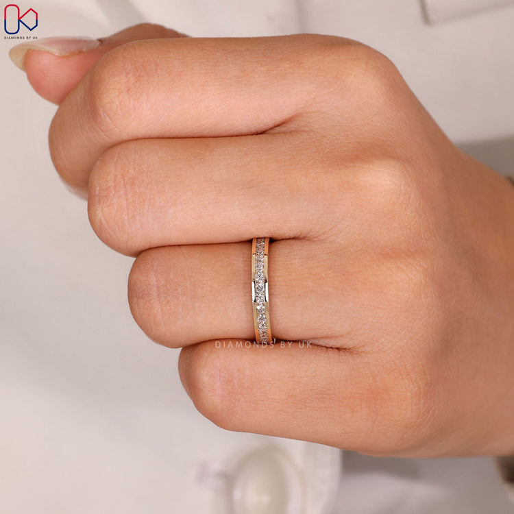 Yellow gold wedding band with channel set design.
