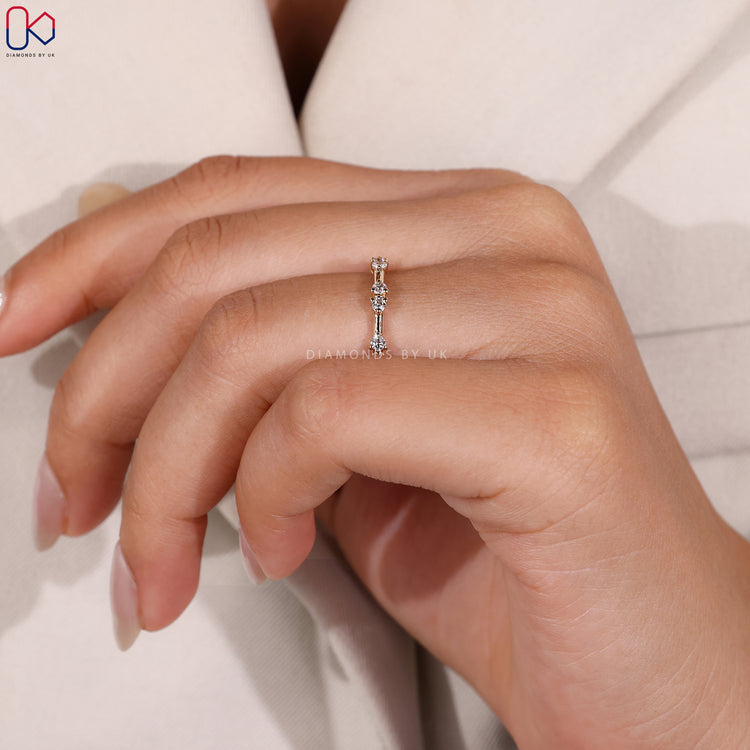 Yellow gold wedding band with prong setting.
