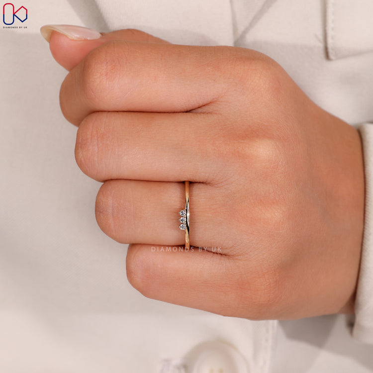 Yellow gold wedding band with round diamonds.
