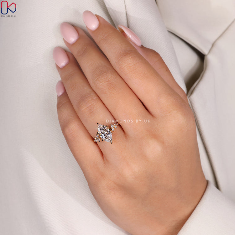 Six prong claw setting marquise diamond engagement ring.
