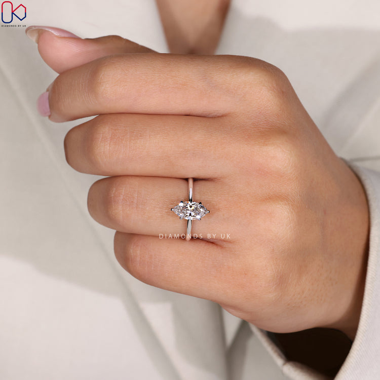 6-claw prong ring featuring a marquise cut diamond.
