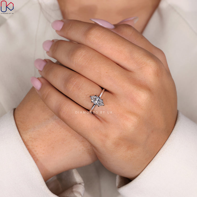 DiamondsbyUK ring with a marquise cut diamond.
